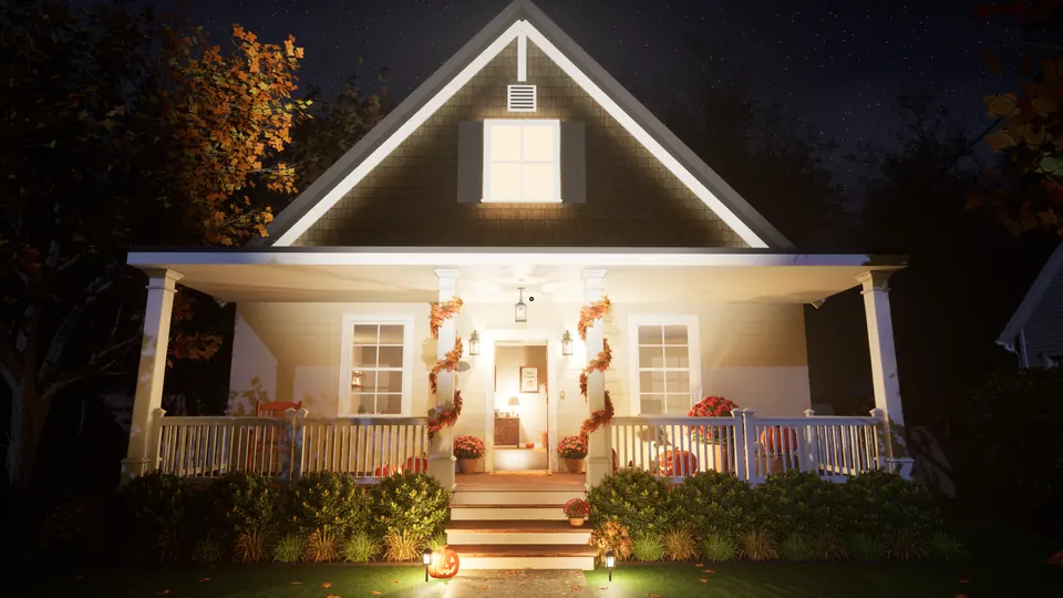 The house at night: a lit front porch with autumn garland on the posts, the front door open and a jack-o'-lantern on the steps